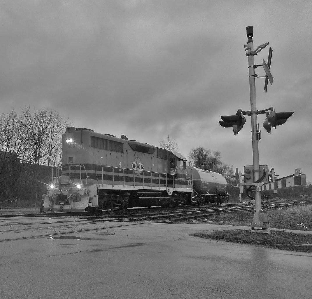 Sometimes you just gotta go out in the rain...  582 pulls tankcar UCLX 16118 from XW30 to drop it in XV yard for 580.To see more photos, visit:  https://www.flickr.com/photos/132395721@N08>