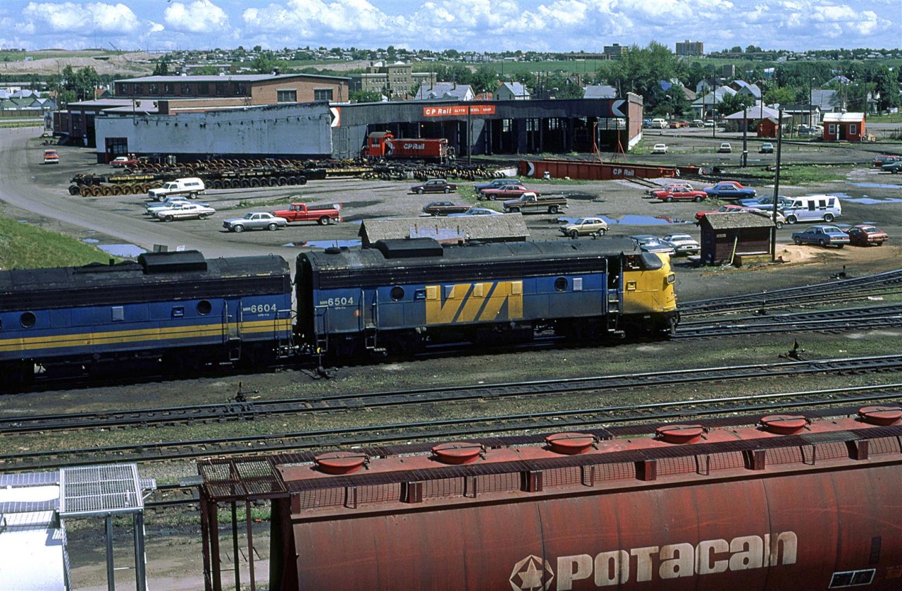 This is as much about the main subject as the background.
I am not certain about the pattern, but VIA must have been switching and servicing their power as it came through Calgary. This set came off an eastbound "Canadian", the only train operated with locomotives passing through Calgary at the time.
In the background is the turntable and roundhouse that seemed to have little use, except for the switchers.