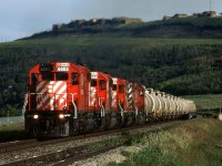 A unit train of Alberta Gas Products cars heads west on this August evening.

Some houses in the background would seem to be in an ideal position for observing action on CP's Laggen Sub.