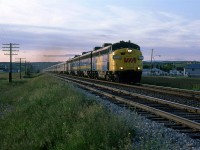 The eastbound "Canadian" runs through Brickburn in the dying hours of sunlight.