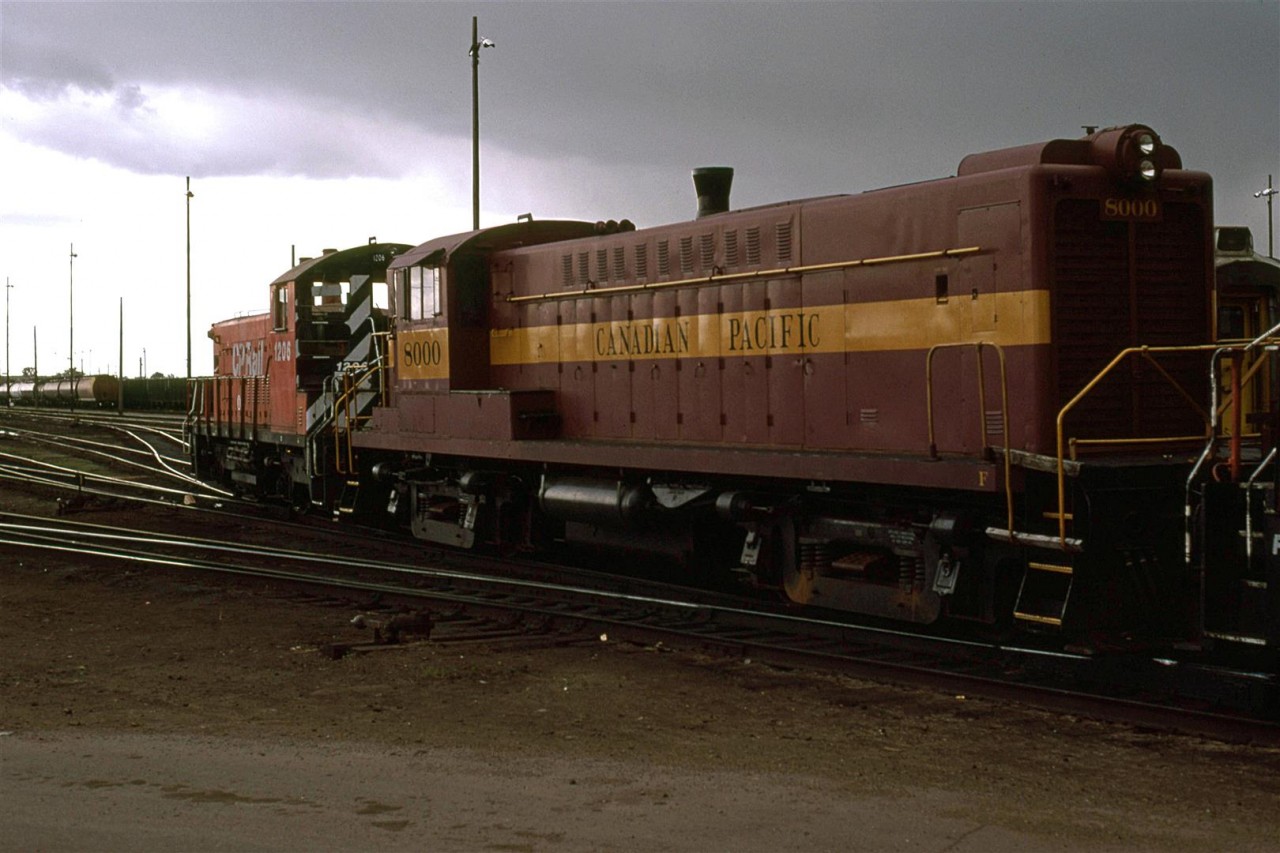 Another shot of the Baldwin DSR4-4 that CP had on hand for their centennial celebration. This time, however, is the only time that I ever saw it moving. I don't believe it was under its own power though.
The rain was just starting but the temperatures had dropped significantly.