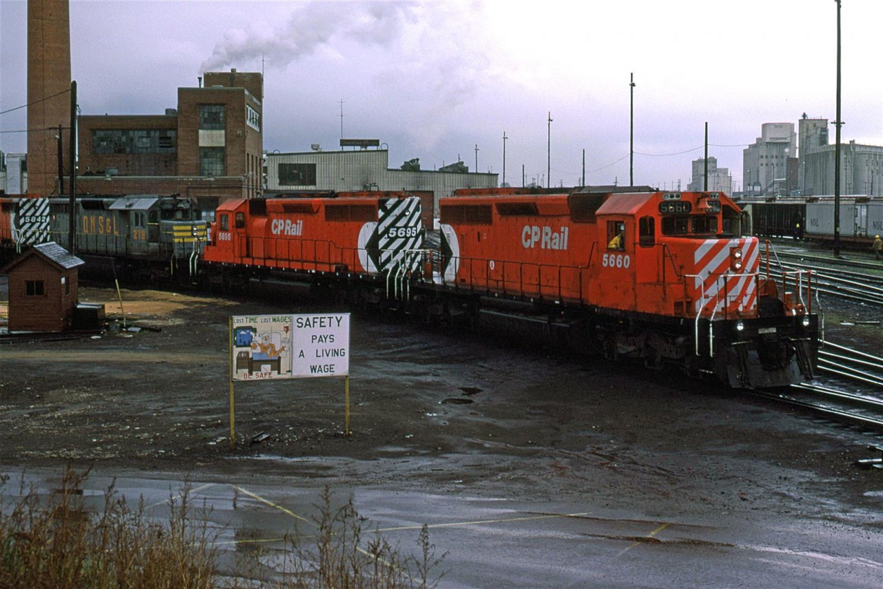 This power set is coming off the shops. The rain has stopped and the temperatures had plumeted, as is often the case in Calgary.
Note the QNS&L 216, trailing.