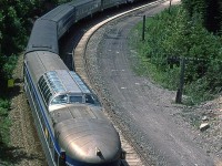 The rear end of the eastbound "Canadian" as it travels between spiral tunnels on Kicking Horse Pass.
