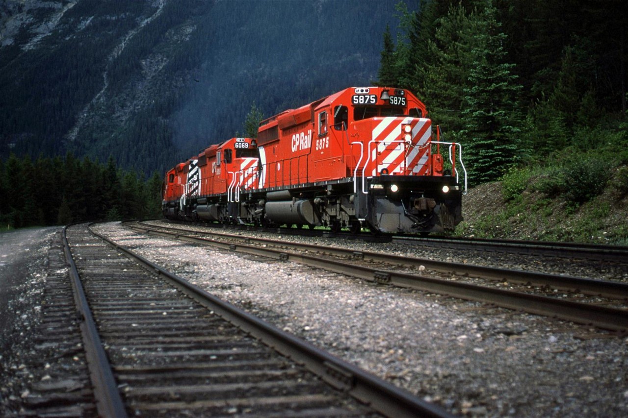 My note say this is eastbound and at Partridge. I don't think that one of those observations is correct. I don't remember Partridge having a third track, and the engines look to be working hard. Therefore, I believe that this is Yoho, and it is working uphill toward the east..