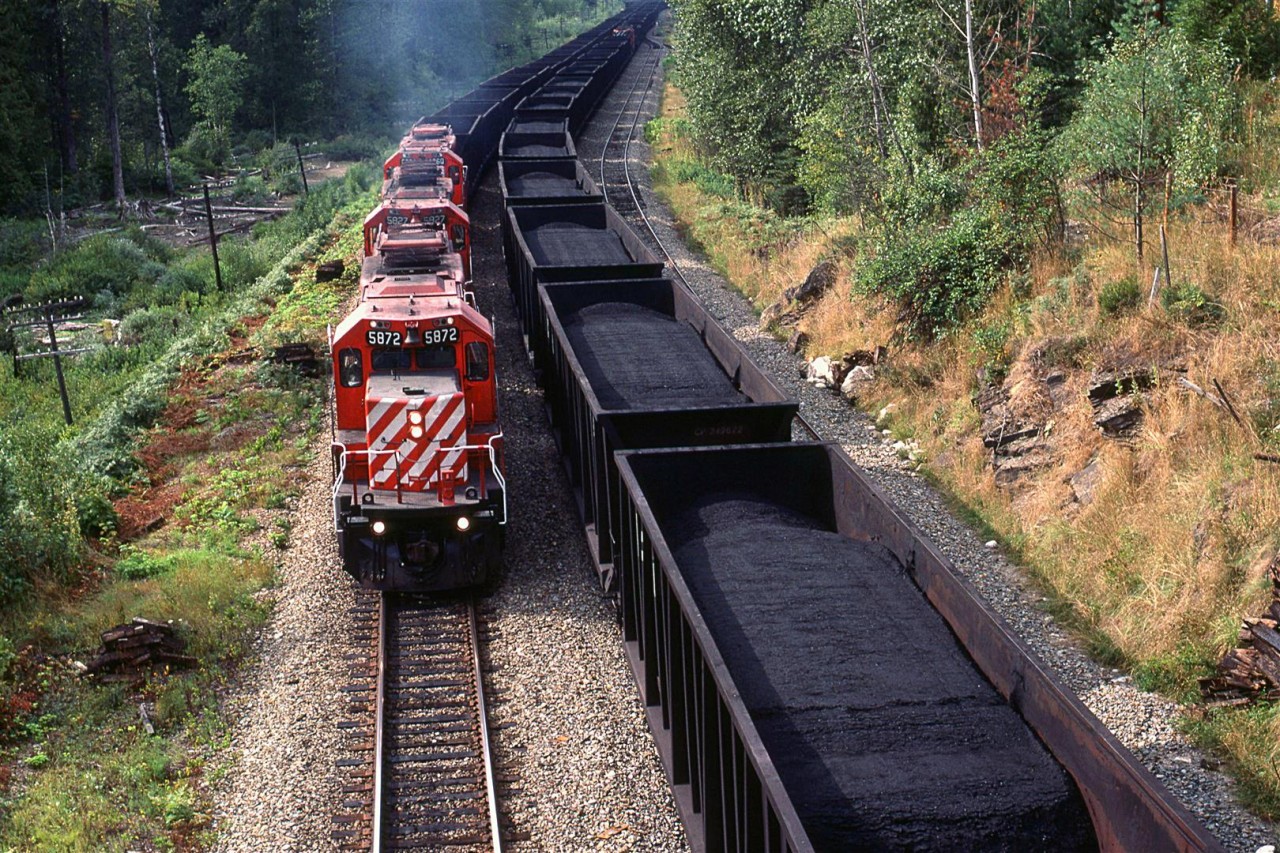 Coal conveyor belt - Coal west, empties east.
Note the mid train helper on the loads.