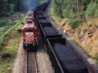 Coal conveyor belt - Coal west, empties east.
Note the mid train helper on the loads.