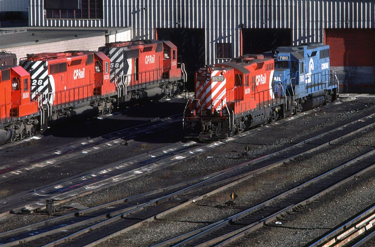 A high nose GP-9 and a leased CR GP-38 await their next assignment on a local out of Calgary.