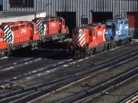 A high nose GP-9 and a leased CR GP-38 await their next assignment on a local out of Calgary.