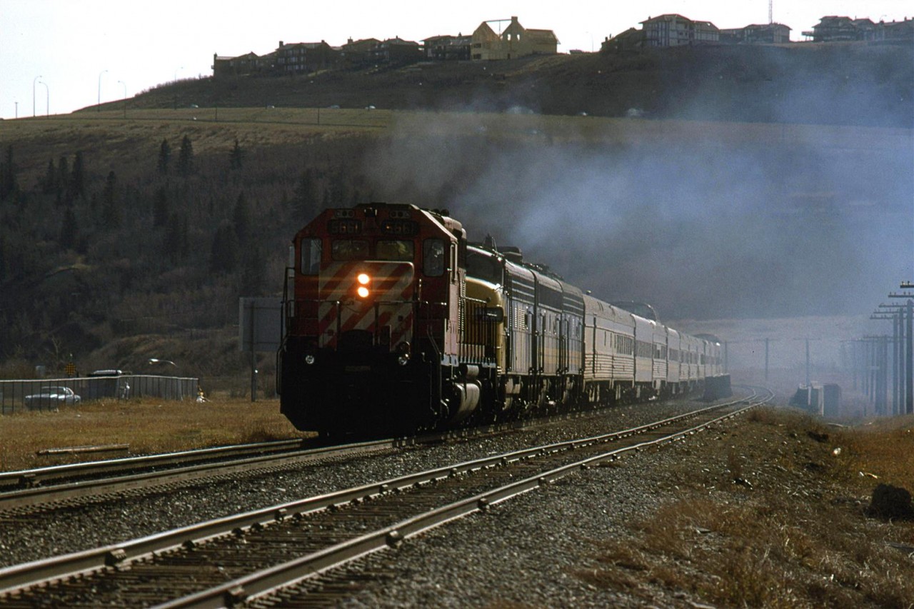 It looks like all three VIA F units are putting out exhaust - albeit with quite a bit of oil being burned as indicated by the blue smoke. Perhaps, someone figured that the old units wouldn't make it to Vancouver. 
The train is on the main adjacent to Brickburn Siding. If one looks very carefully, the east signal for Brickburn may be seen above the chain link fence at the extreme left.