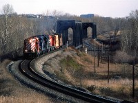 A short Exshaw Turn is crossing the Bow River and will shortly stop in at Kieth Yard before continuing west to Exshaw (and maybe Canmore - I don't know there the lumber was destined to be unloaded). I like the high nosed GP's and went out of my way to photograph them when they were assigned the duties for this regular train. It was a bonus to have the two CR GP-38's included.