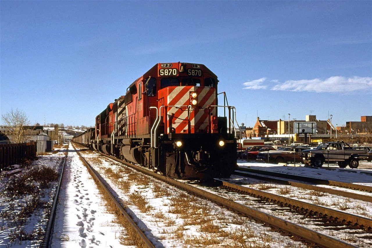 I ventured out at lunchtime to catch the eastbound "Canadian", but as is often the case, CP ran a frieght just ahead of it. There is really nothing remarkable about the photo, however, I noticed the string of cars just behind the locomotives seem to be a little different. They are mid-height, covered gondolas, I believe. Perhaps a mining concentrate?