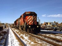 I ventured out at lunchtime to catch the eastbound "Canadian", but as is often the case, CP ran a frieght just ahead of it. There is really nothing remarkable about the photo, however, I noticed the string of cars just behind the locomotives seem to be a little different. They are mid-height, covered gondolas, I believe. Perhaps a mining concentrate?