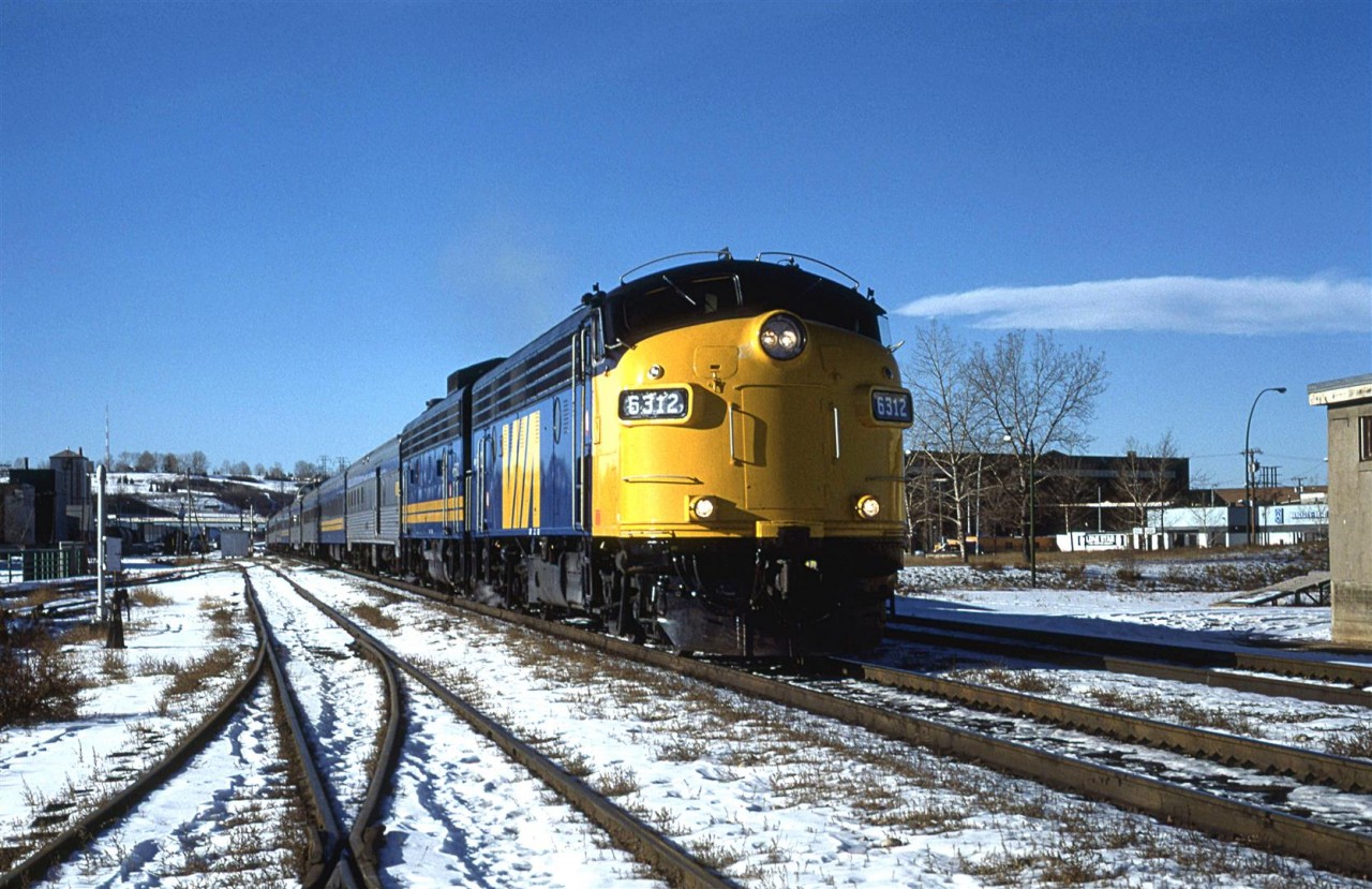 The 6312 appears to be fresh out of the paint shops as it leads the eastbound "Canadian" into downtown Calgary.