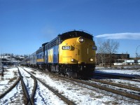 The 6312 appears to be fresh out of the paint shops as it leads the eastbound "Canadian" into downtown Calgary.