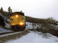I guess I thought that the train would be longer and the tail would be visible to the right. Perhaps, early December is not the time to expect a long "Canadian". So, I ended up with a nose shot of a shiny, newly painted VIA locomotive.
The red signal is at the east switch of Brickburn Siding.