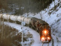 A loaded Liquid Petroleum Gas train approaches the east switch of Brickburn. It looks like the switch heaters have been used recently.