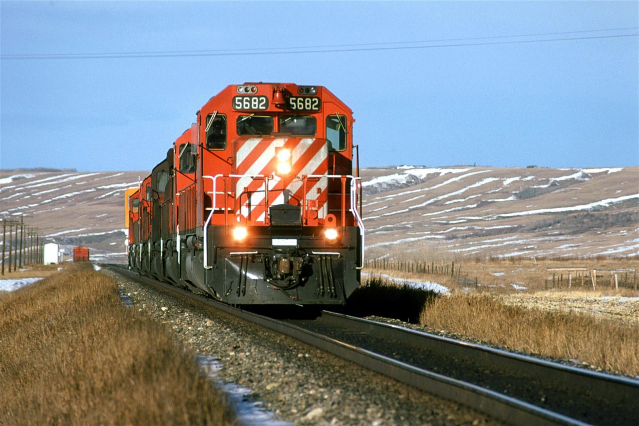 These movement really puzzled me. Were they simply power re positioning? I would often see cab hops between Kieth yard in West Calgary and the Shops at Alyth, but this is west of Kieth. 
For re positioning, why wouldn't CP simply stick a few extra engines on a hot train?
Any ideas?
This is also when I began to discover the wonderful topography just west of Calgary. I loved shooting in the Bow Valley between here and the far side of Cochrane.