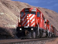 At 5 to 3, the sun is starting to get pretty low in the sky. What appears to be a grain unit train is really a manifest with all sorts of different cars.