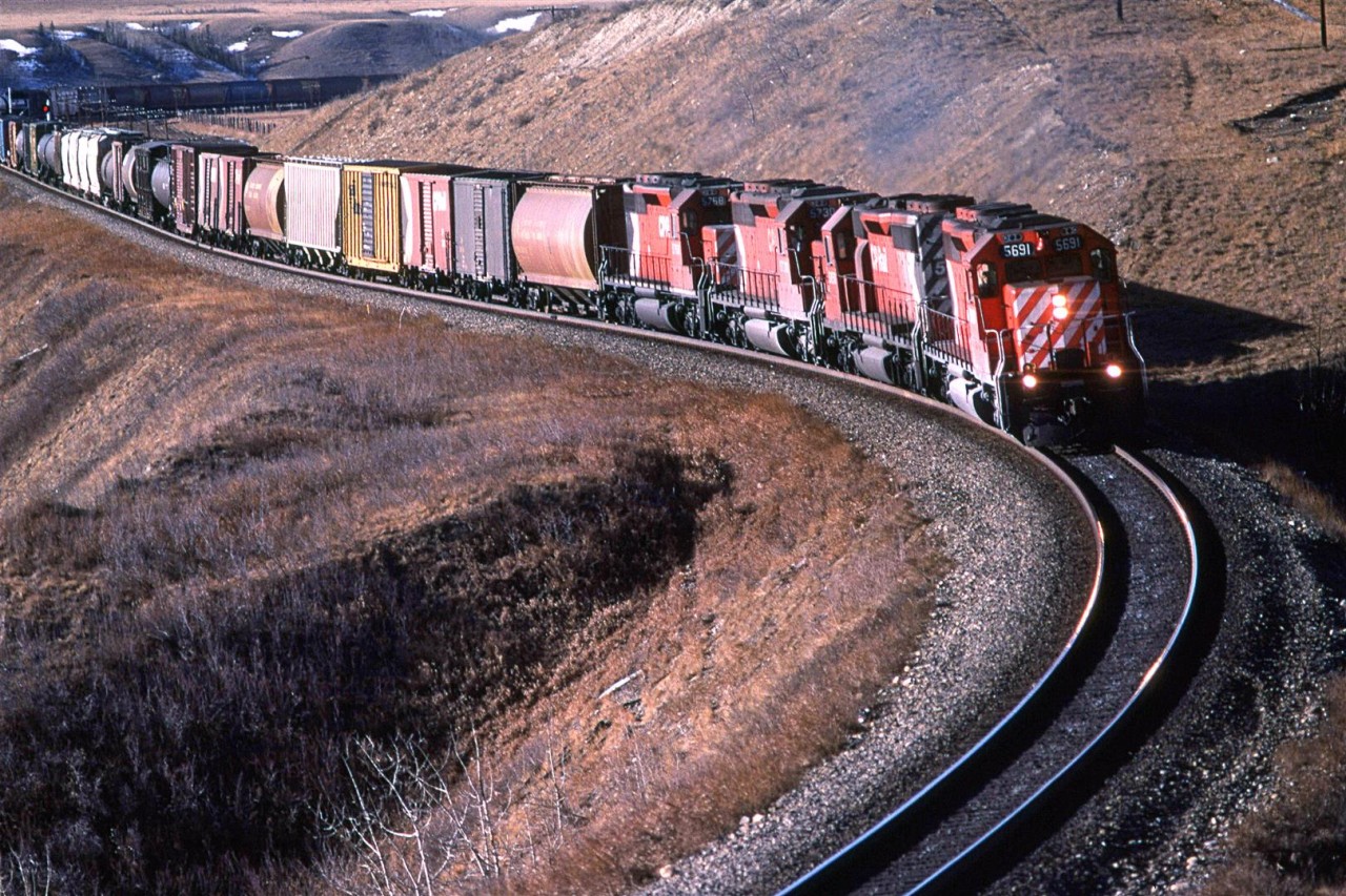 Another eastbound mixed bag of a train is through Cochrane on its final leg into Calgary.