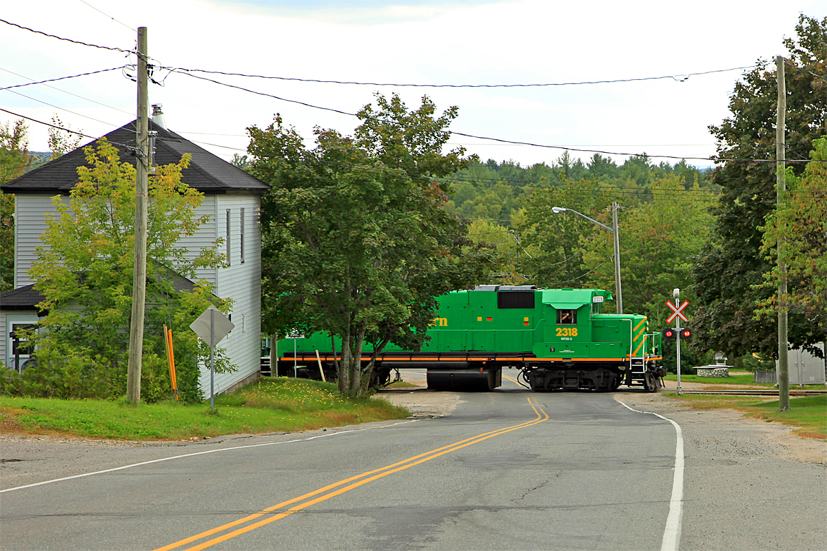 Engineer Gilles (two weeks shy of retirement) and conductor Chris bid us adieu crossing Harvey Road heading out of McAdam for St. John. We'd catch up with them again in a couple of days at Welsford right where they said they'd be, waiting to haul a load of government and railway dignitaries to view infrastructure upgrades so the suits could see an example of where their joint investment money was going.