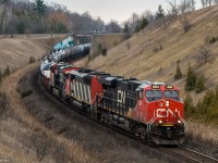 On a cloudy day, CN M305 comes up the grade at Beare, with an CN Barn sandwiched between a pair of GEVOs.(14:10)

CN 2834 ES44AC, CN 5547 SD60F, CN 2869 ES44AC