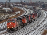 Finally a bit of snow!

With a bit of snow on the ground, CN 369 comes through Whitby under the Hopkins St overpass, with a trio of units, featuring a high-cab headlight SD70M-2 and an old and faded C44-9WL.

CN 2268 ES44DC, CN 8014 SD70M-2, CN 2503