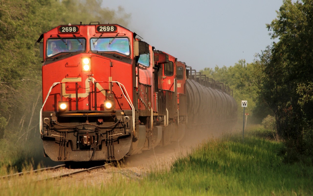 CN 527 slows down for a 10MPH slow half a mile up the tracks at Nampa, Alberta. Today this train wasn't too long, only 8500'.