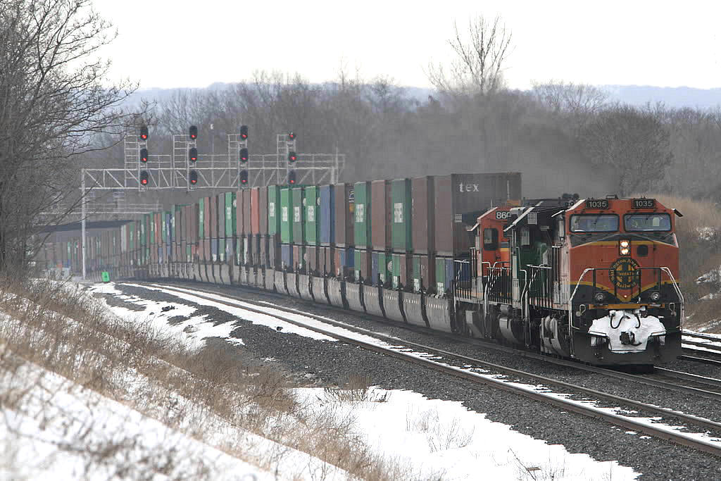 A mild March winter day..sees this "occasional" intermodal train 150 with all marine containers heading east with a trio of BNSF power.  Anyone know what the origin /destination of this train was, the WB counterpart was 151; it disappeared quite some time ago.