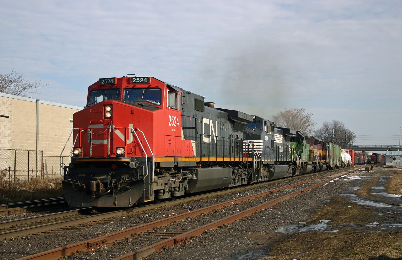 CN 399 rolls through London with a colourful lashup consisting of CN 2524, NS 9290, BNSF 8012 and WC 6497.