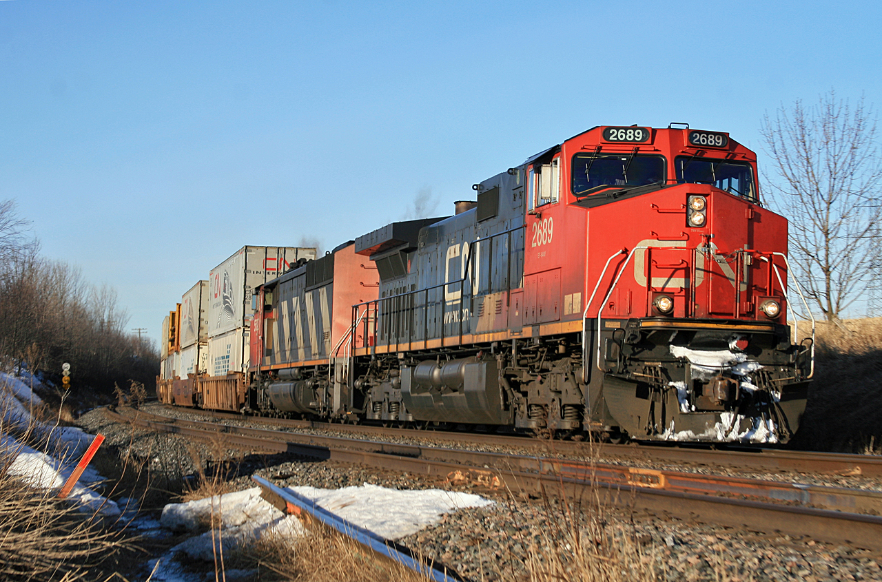 Vancouver to Montreal hotshot 106 is making a mile a minute thru Clarke West with CN 2689 and CN 5520 providing the power.