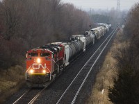 CN 376 with two SD70M-2s as lead locos struggling uphill at full throttle trying to haul a really long consist.