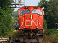 The sun has already started to set on this warm August night, as the front of CN 5752 appears with a long string of tanker cars crawling it's way past the Brantford station. Soon, an eastbound VIA set will make it's daily evening visit at the station.