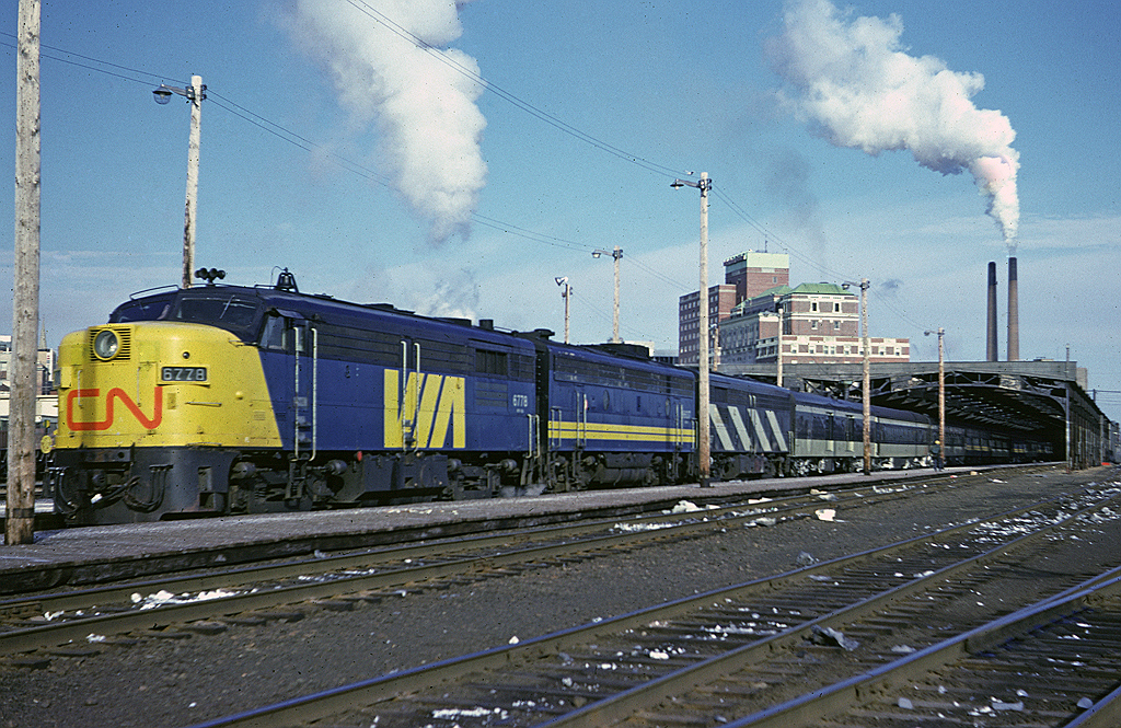 Via Rail FPA-4 6778 sits at the head end of #15 at Halifax Ocean Terminal shortly before the train's departure time for Montreal. The consist was the typical mix of CN and Via painted cars seen in this period.