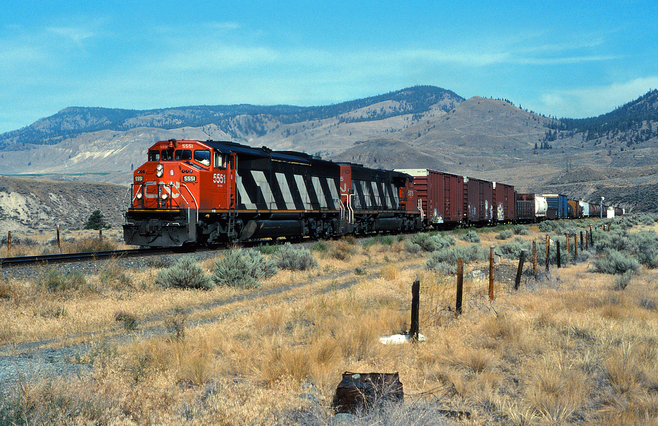 After meeting a westbound at McAbee, CN 5551 and CN 5275 accelerate eastwards through Juniper Beach Provincial Park in the Thompson River Canyon