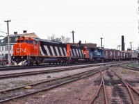 CN 9902, CN 5267 and Conrail 6619 lead a westbound freight through St-Henri.  CN 9902 is an EMD SD60F, built in late 1985 and will only be renumber to the 5502 in 1988.