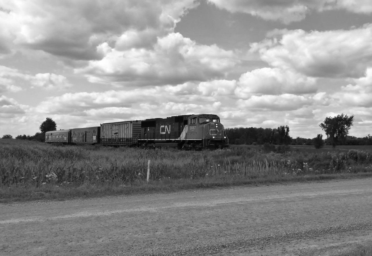 The last run of the eastern set of the CNR TEST train (with the new boxcar behind the locomotive) heads south on it's trip back to Stratford, and then towards London, where the equipment would be parked on the wye at London Junction, and retired.  Here, the trains speeds south at Road 150.To see more photos of this train, and others, visit: https://www.flickr.com/photos/132395721@N08/