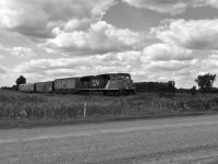<b>The last run</b> of the eastern set of the CNR TEST train (with the new boxcar behind the locomotive) heads south on it's trip back to Stratford, and then towards London, where the equipment would be parked on the wye at London Junction, and retired.  Here, the trains speeds south at Road 150.<br><br>To see more photos of this train, and others, visit: <a href=https://www.flickr.com/photos/132395721@N08/> https://www.flickr.com/photos/132395721@N08/</a>