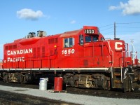GP9u built in 1957 , rebuilt in 2002 then equipped with the exhaust contraptions seen in this photo to filter exhaust particles to work at GM's Oshawa plant. This locomotive was declared surplus in April 2015.