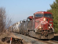 After hearing CP 9833 call clear to Baxter, I made a quick detour up Line 5 to the tracks; arriving just in time!  CP 9833 leads train 118-03 through the farmland just outside of Alliston.  CP 9727 is out of sight, mixed in amongst the 69 loads and 3 empties that make up train 118.  These two AC44's will have no issue keeping this 8191 ton, 6561 foot long train rolling along at trackspeed.