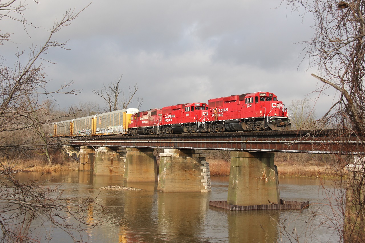 The CP Hagey Turn trundles south towards the Toyota plant with 17 multis. Here it is pictured over the Grand River in the south end of Kitchener (also known as Freeport). The sun came out briefly adding a bit of light to an otherwise dull scene this snowless Christmas season. Power was CP 2214-2281-3045.