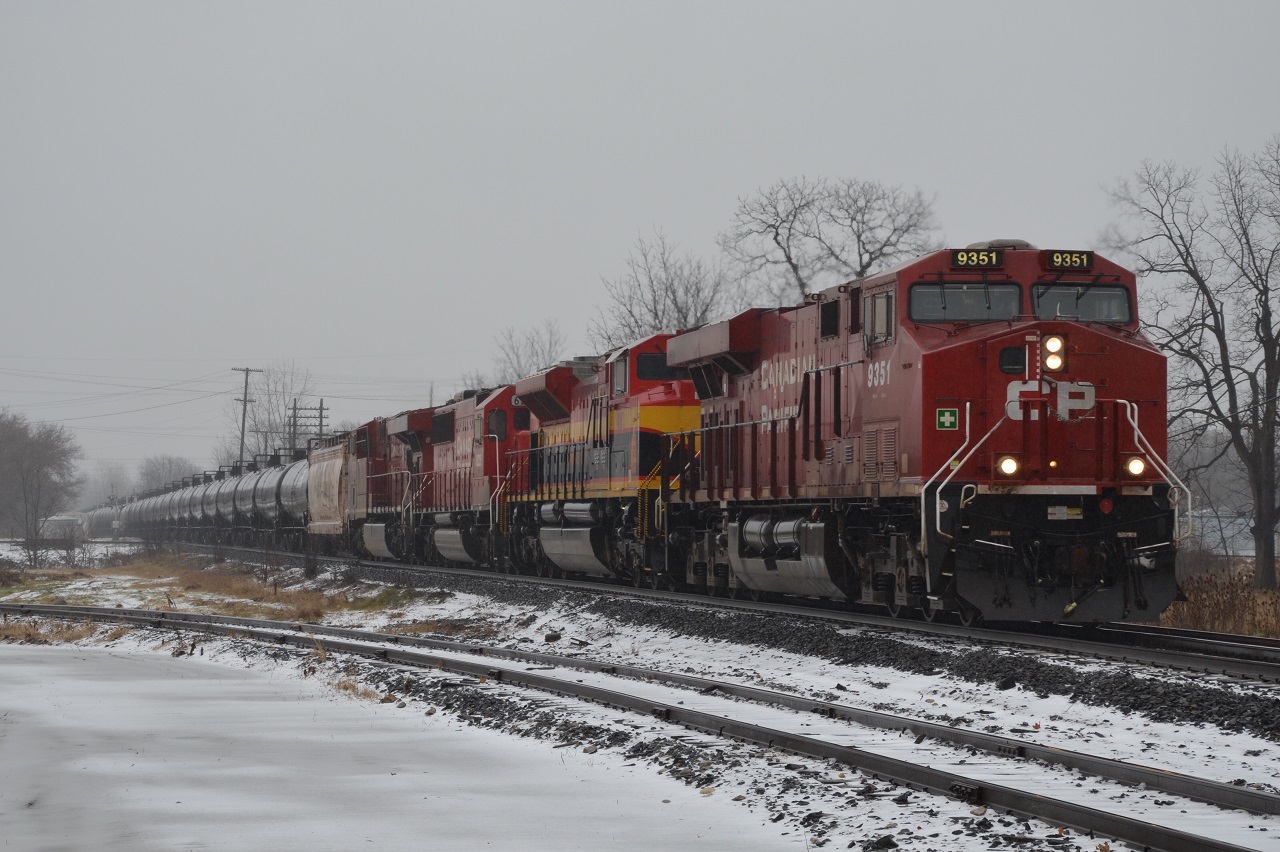 In a snow/rain mix, CP 647 approaches London yard on a medium to stop signal. The two trailing units will be dropped in London.
