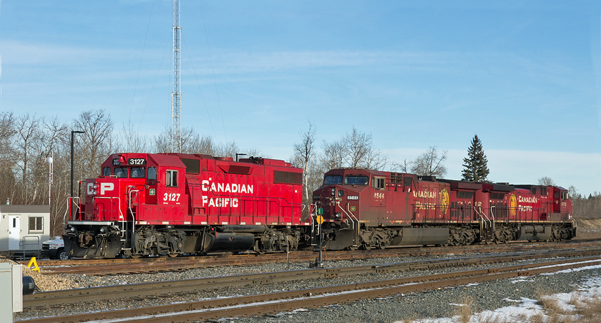 Waiting in CP's Scotford Yard for their next assignment are GP38-2 CP 3127, and AC4400CW's CP 8544 and 9712