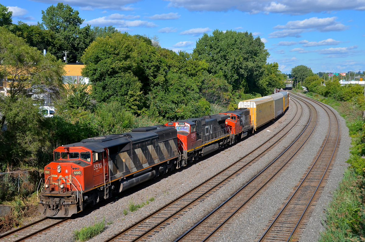 A nice elephant style lashup. Zebra-striped CN 5510 leads CN 401 through Montreal West. Trailing elephant style are CN 2554 and CN 9639.