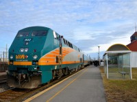 <b>Looking out at a busy station scene.</b> A crewmember is looking out of the lead engine of VIA 55 and witnessing a very busy boarding of Christmas day passengers at Dorval station. Soon the train will depart for Toronto, by way of Ottawa.
