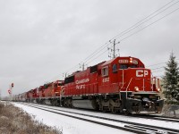 With <b>All-EMD on a loaded grain train.</b> With 103 loaded grain hoppers, a Quebec Gatineau train with 4 CP EMD's (CP 6252, CP 5919, CP 6239 & an unknown SD40-2) heads east on CP's Park sub, approaching the AMT station of Chabanel