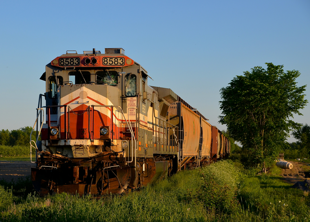 The last train to ever operate on the MMA Stanbridge Sub. The ex-MMA Stanbridge Sub (now owned by CMQ) has had crossings paved over in Farnham and in Bedford, thus sealing the fate of the line. This means that the train that was stranded on the line for nearly a year (shown here) was the last train to operate on this short ex-CP branch line. The teain was stranded due to a derailment about half a mile north of this crossing. The engine and the cars were moved about two weeks after this photo was taken.