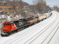 <b>Double Dash8's.</b> CN 527 with freshly repainted at the time CN 2010 (ex-UP C40-8) and BCOL 4608 head west on the transfer track of CN's Montreal sub towards nearby Taschereau Yard.