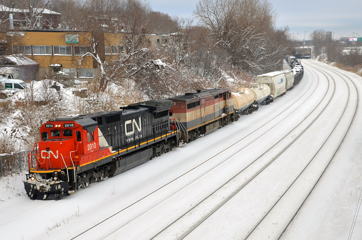 Double Dash8's. CN 527 with freshly repainted at the time CN 2010 (ex-UP C40-8) and BCOL 4608 head west on the transfer track of CN's Montreal sub towards nearby Taschereau Yard.