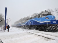 <b>First big snowstorm of winter.</b> AMT 1348 (rebuilt and repainted by Brookville recently) is pushing a deadhead train towards Montreal West Station on the day Montreal got its first big snowstorm.