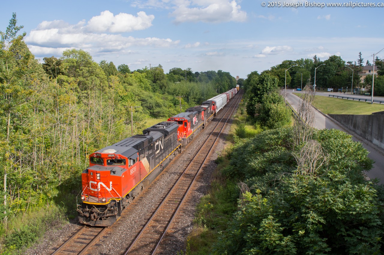 Going Wide At Paris Road CN 435 is seen departing Brantford with CN 8839 manning the point on a sunny August afternoon.